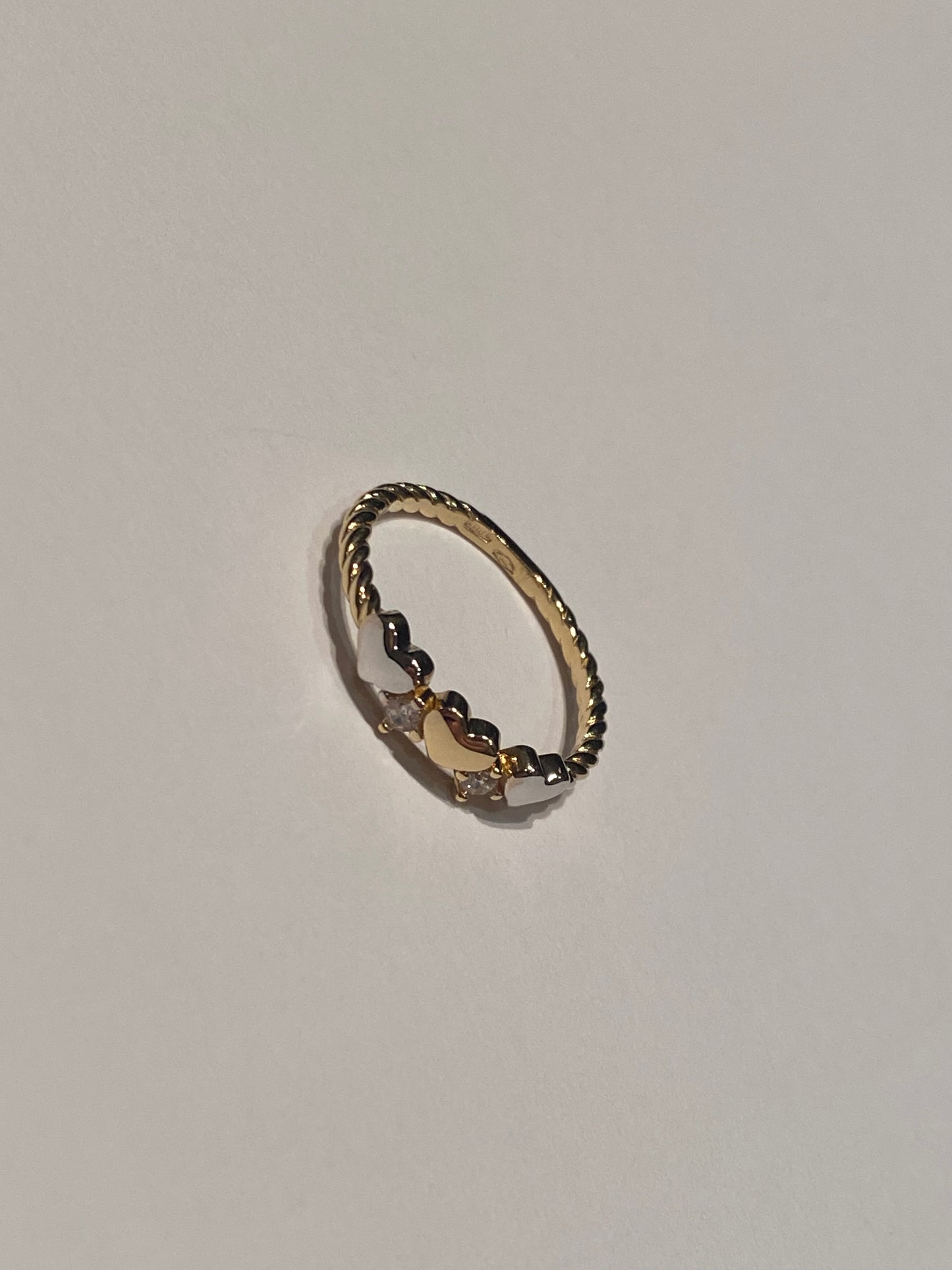 Anello cuoricini intrecciato Oro 18K