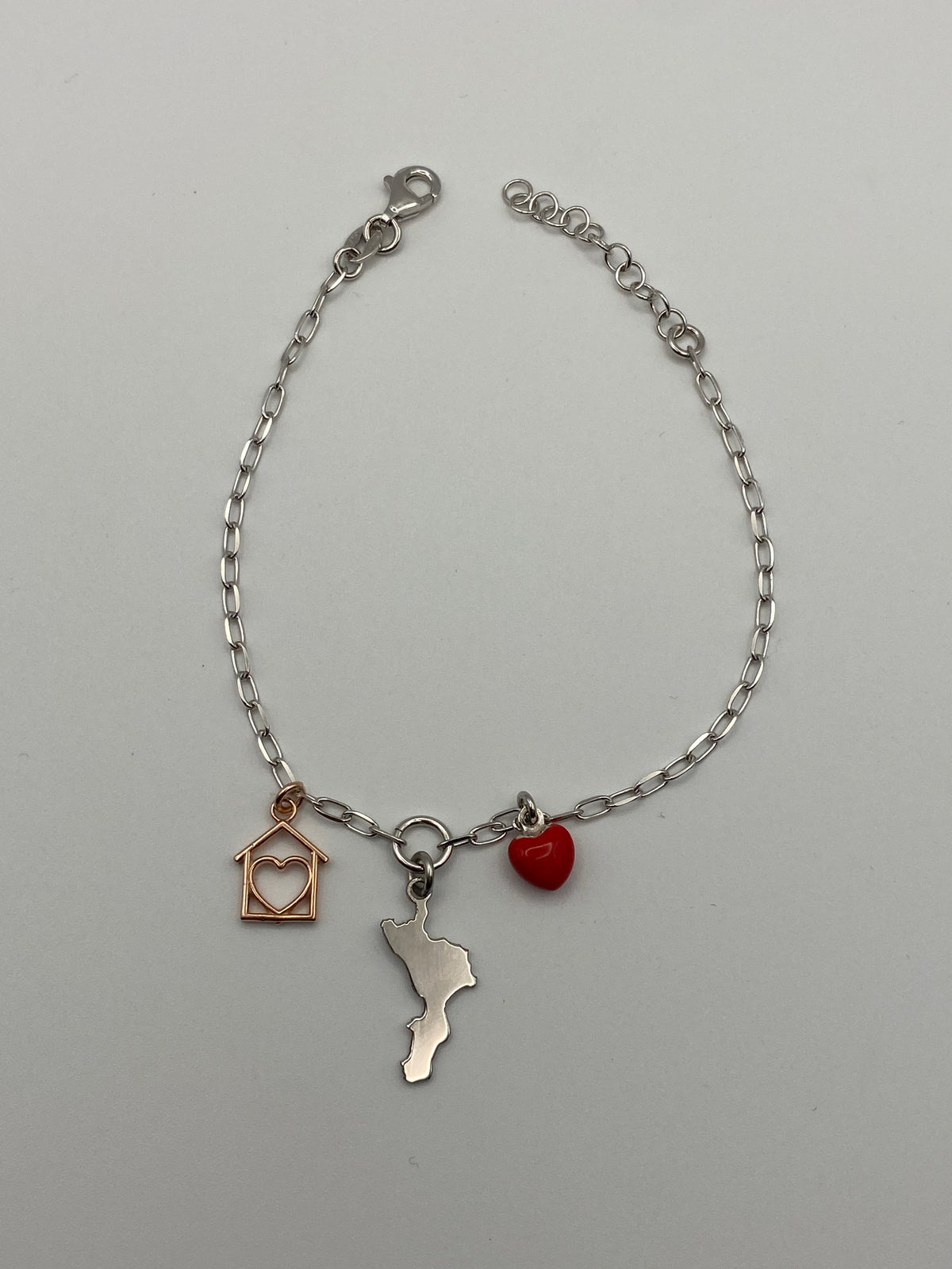 Bracciale Calabria Casa mia in argento 925 con sagoma della Calabria, cuoricino smaltato e casetta - Zumpano Gioielli