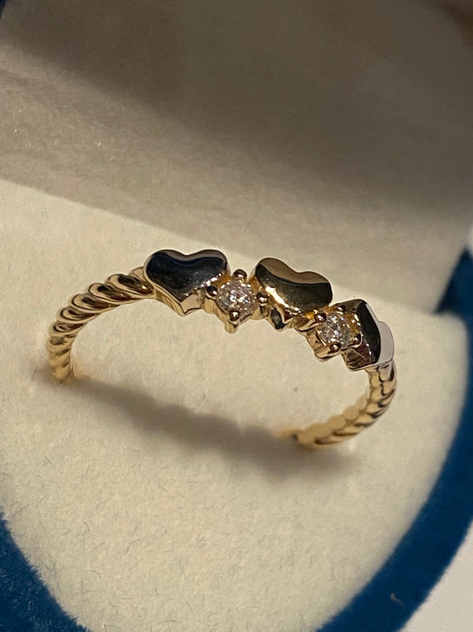 Anello cuoricini intrecciato Oro 18K